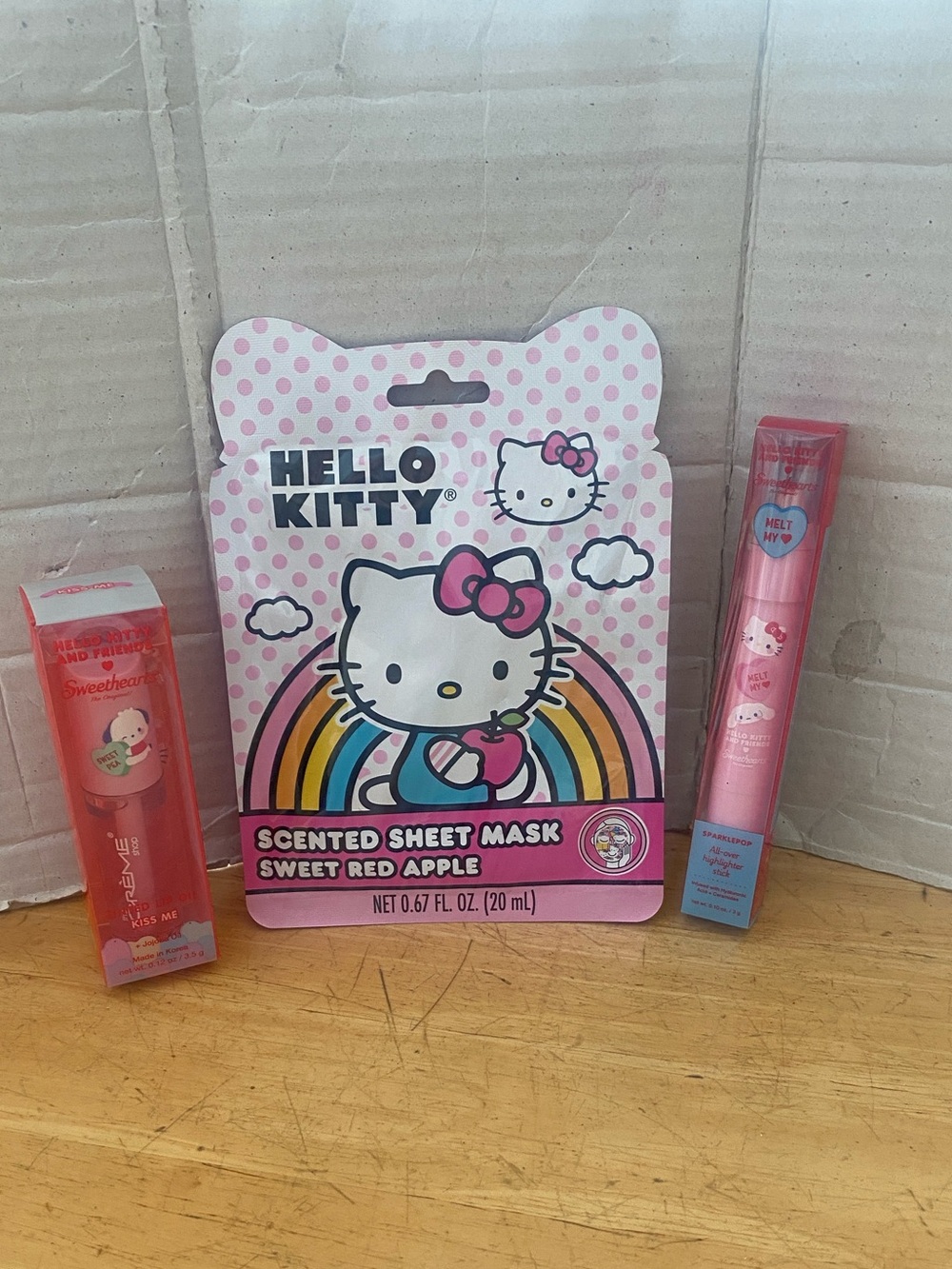 Hello Kitty bundle lip oil, all over highlighter, Red Apple face mask NWT